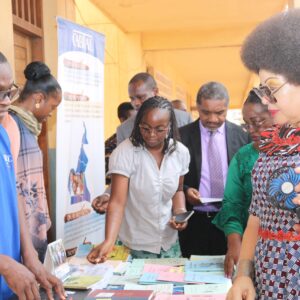 The Secretary of State to the Minister of Basic Education, Asheri Kilo, visits our stand during the International Mother Tongue Day
