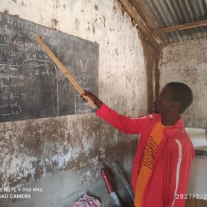 Literacy-class-in-the-Mada-community-scaled-1